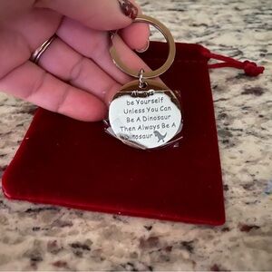 Always be yourself unless you can be a dinosaur then always be a dino keychain